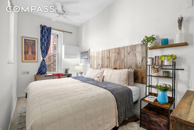 bedroom featuring wood finished floors