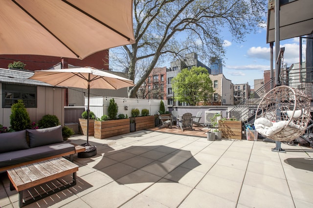 1059 Manhattan Ave Unit 2D, New York City, NY 11222 - view of patio / terrace with outdoor lounge area, outdoor dining space, and a city view