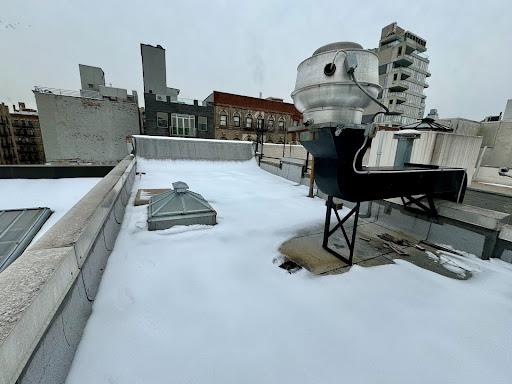 view of yard layered in snow