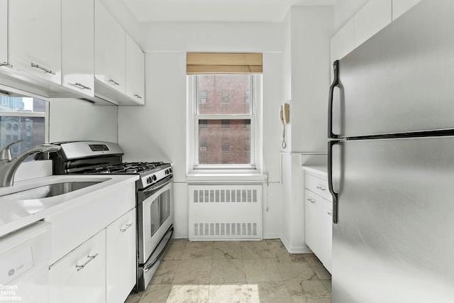 11 Riverside Dr Unit 15Tw, New York City, NY 10023 - kitchen with white cabinets, marble finish floor, appliances with stainless steel finishes, and radiator