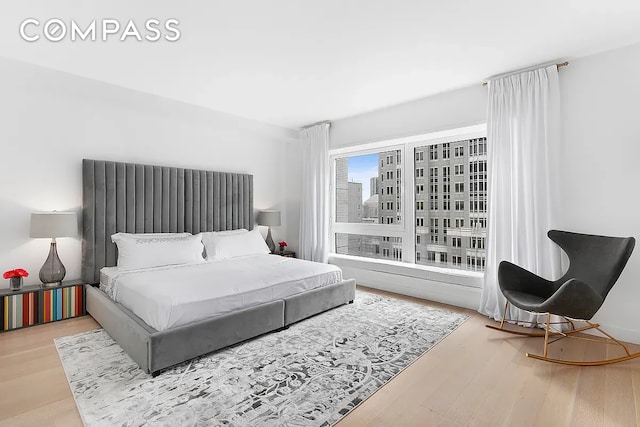 135 W 52nd St Unit 40A, New York City, NY 10019 - bedroom with wood finished floors