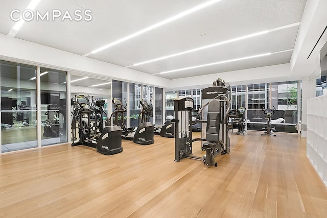 135 W 52nd St Unit 40A, New York City, NY 10019 - workout area with wood finished floors