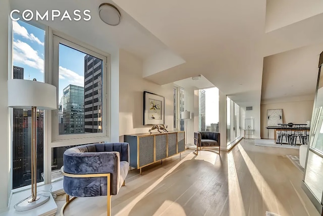 135 W 52nd St Unit 40A, New York City, NY 10019 - living area with light wood-style flooring