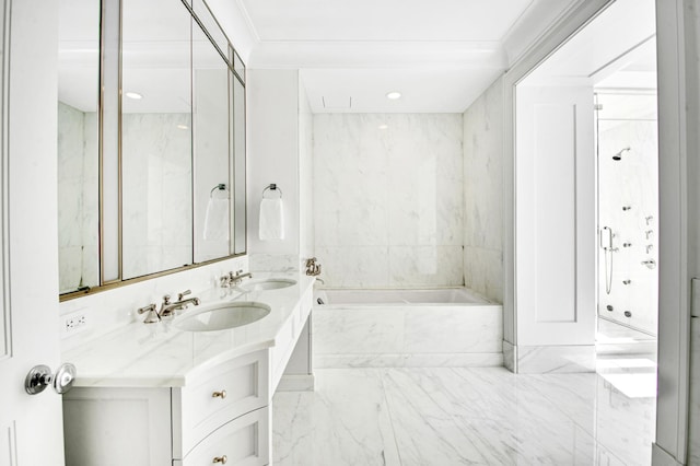 full bathroom with marble finish floor, double vanity, a bath, and a sink