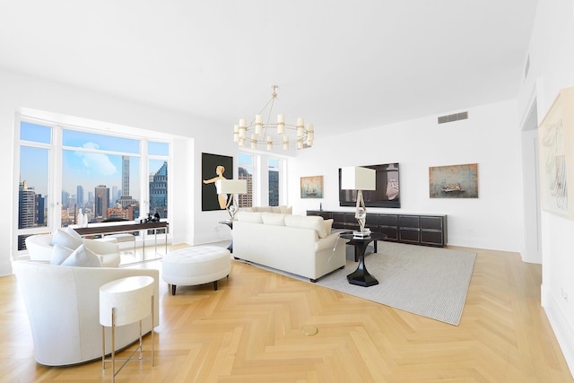 living area featuring baseboards, visible vents, and an inviting chandelier