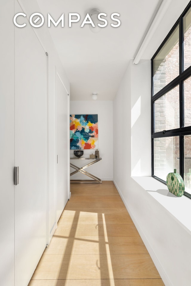 hallway featuring light wood-style floors