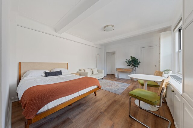 70 Remsen St Unit 9E, New York City, NY 11201 - bedroom with beam ceiling and wood finished floors