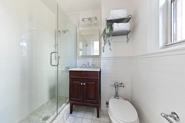 70 Remsen St Unit 9E, New York City, NY 11201 - bathroom with a stall shower, tile walls, vanity, toilet, and tile patterned flooring