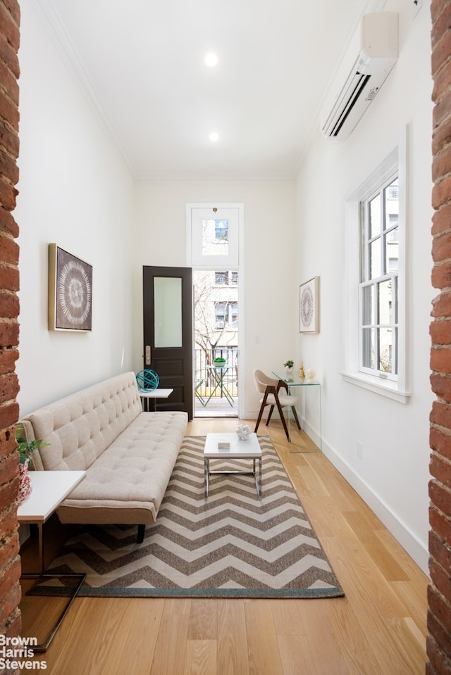 143 W 85th St Unit 2, New York City, NY 10024 - living room with a wall mounted AC, plenty of natural light, baseboards, ornamental molding, and wood finished floors