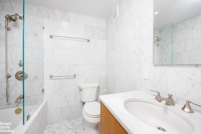 143 W 85th St Unit 2, New York City, NY 10024 - bathroom with tiled shower / bath, tile walls, toilet, and vanity