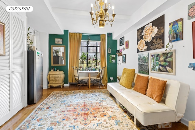 45 Tudor City Pl Unit 808, New York City, NY 10017 - sitting room with a chandelier, wood finished floors, beamed ceiling, and baseboards