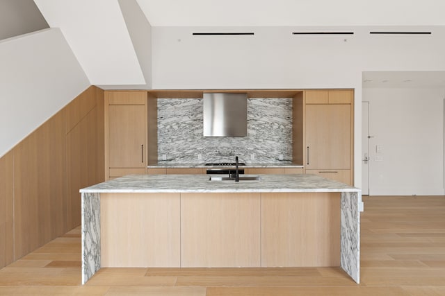 517 W 29th St Phc, Phc, New York City, NY 10001 - kitchen featuring range hood, modern cabinets, and light brown cabinetry