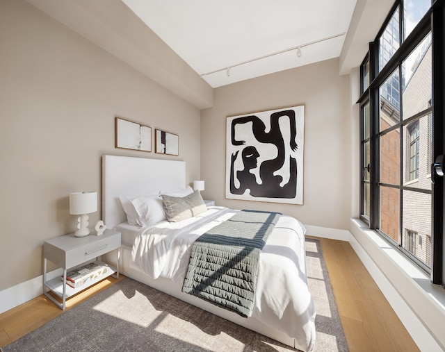 517 W 29th St Phc, Phc, New York City, NY 10001 - bedroom featuring track lighting and wood finished floors