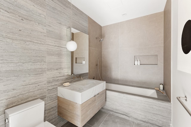 517 W 29th St Phc, Phc, New York City, NY 10001 - bathroom featuring tile walls, vanity, tile patterned floors, and tiled shower / bath combo