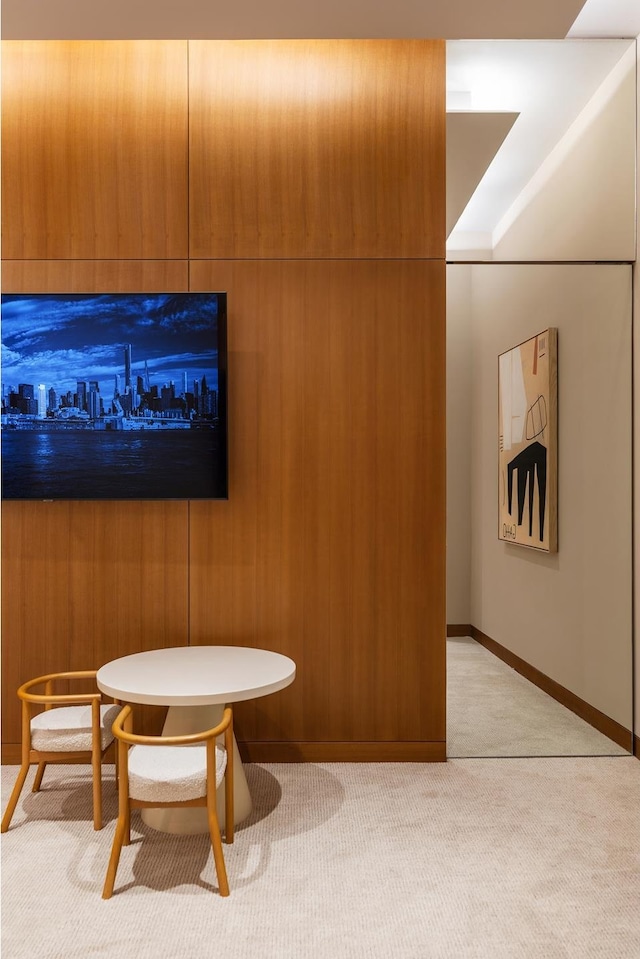 interior space with carpet floors and baseboards