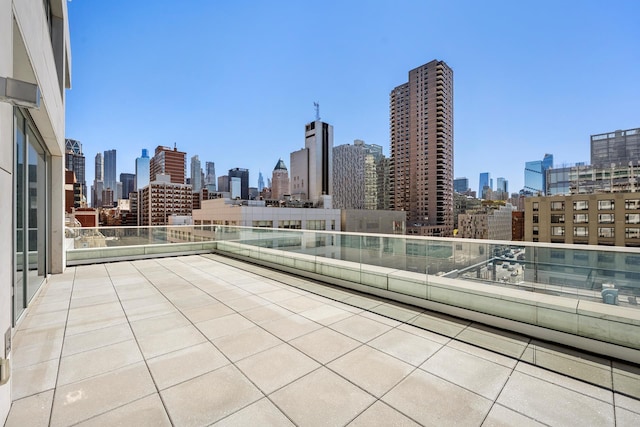 view of patio / terrace with a city view and a balcony
