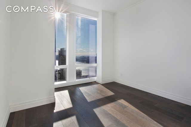 35 Hudson Yards Unit 5805, New York City, NY 10001 - spare room featuring dark wood-style flooring and ornamental molding