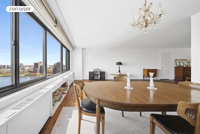 dining room featuring a view of city and an inviting chandelier