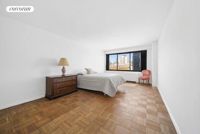 bedroom featuring visible vents and baseboards