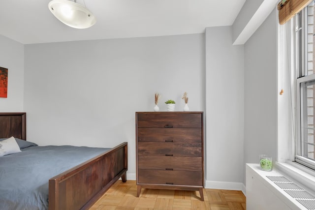bedroom featuring baseboards