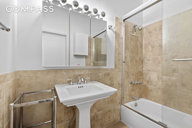 565 Broadway Unit 8W, New York City, NY 10012 - bathroom with bathing tub / shower combination and tile walls