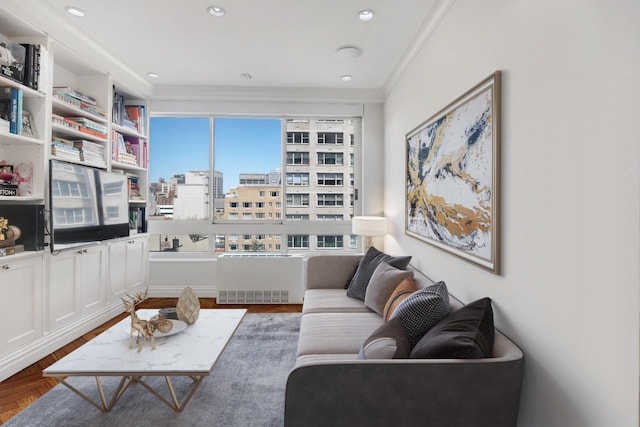 living room featuring radiator heating unit and crown molding