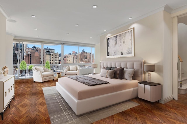 bedroom with a view of city and expansive windows
