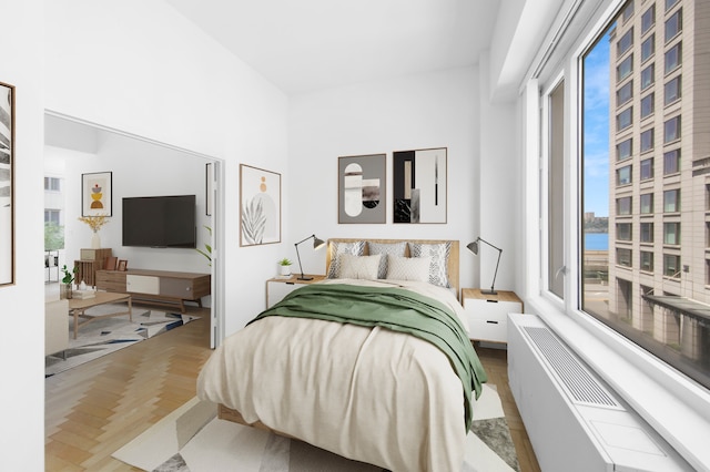 bedroom featuring parquet flooring
