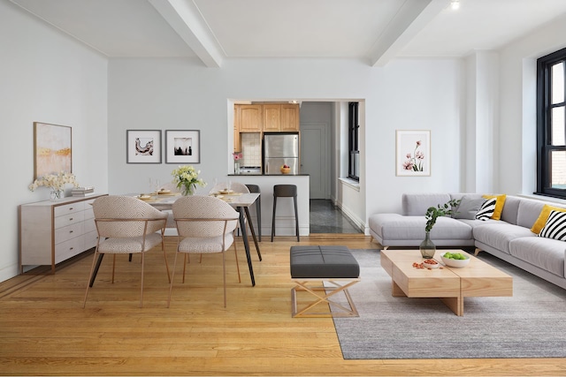 235 E 22nd St Unit 6P, New York City, NY 10010 - living area featuring beamed ceiling and light wood finished floors