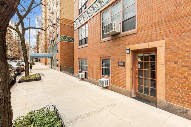 235 E 22nd St Unit 6P, New York City, NY 10010 - view of building exterior with cooling unit and a wall mounted AC
