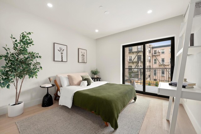 bedroom featuring access to outside, recessed lighting, light wood-style flooring, and baseboards
