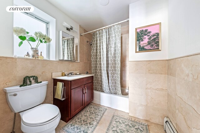 203 W 122nd St Unit 4, New York City, NY 10027 - full bath with tile walls, vanity, toilet, baseboard heating, and shower / bath combo
