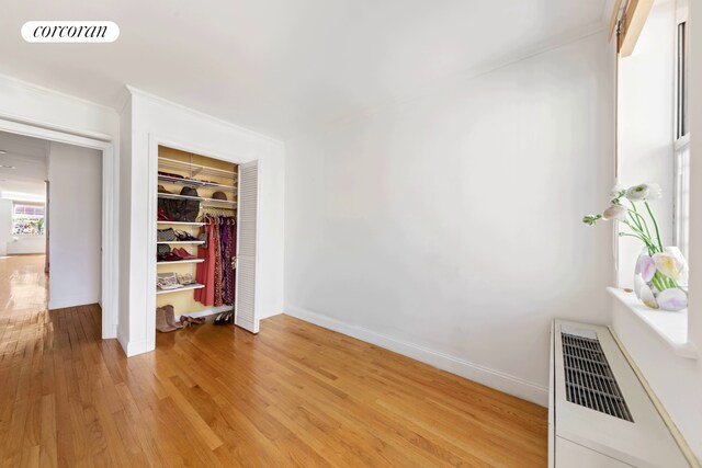203 W 122nd St Unit 4, New York City, NY 10027 - unfurnished bedroom with light wood finished floors, a closet, and baseboards