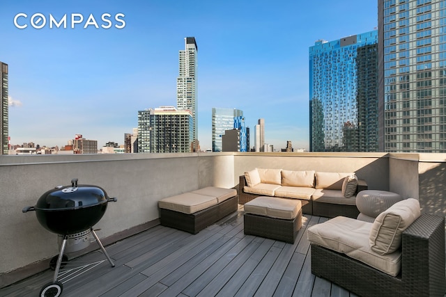 wooden terrace with grilling area, outdoor lounge area, and a city view