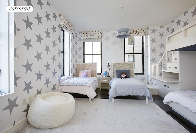 bedroom with wallpapered walls