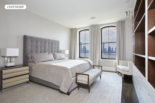 bedroom with wood finished floors