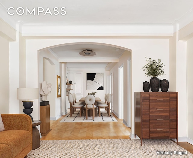 33 E End Ave Unit 9F, New York City, NY 10028 - dining space with arched walkways, crown molding, and baseboards