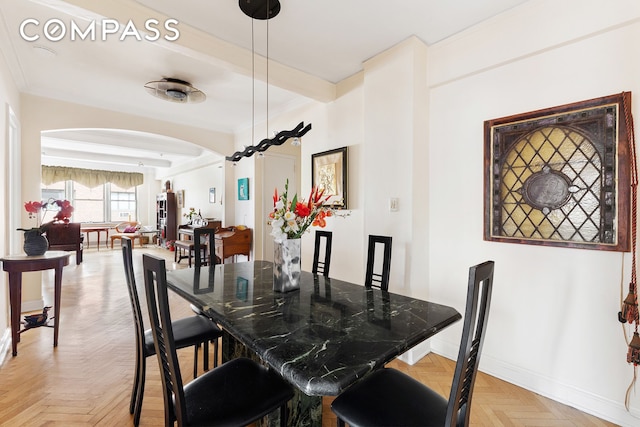 33 E End Ave Unit 9F, New York City, NY 10028 - dining space featuring arched walkways and baseboards