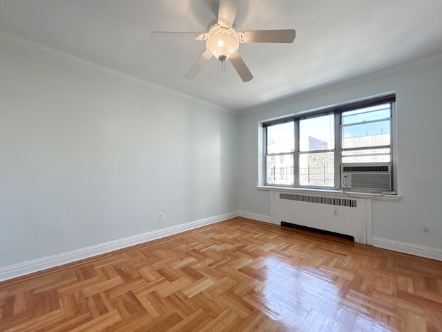 empty room with cooling unit, radiator heating unit, a ceiling fan, baseboards, and ornamental molding