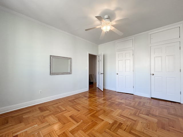 unfurnished bedroom featuring baseboards, ornamental molding, and ceiling fan