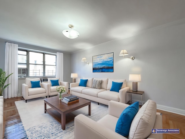 living area with crown molding and baseboards