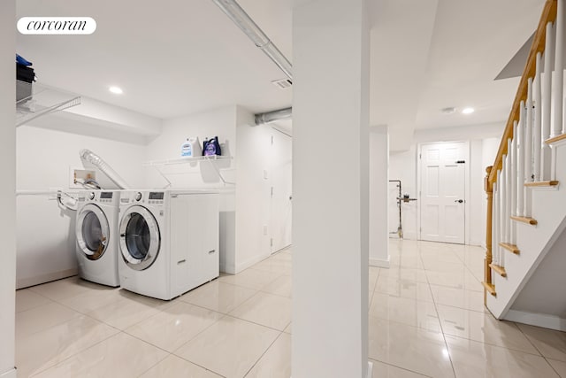 laundry room with laundry area, recessed lighting, light tile patterned floors, and washer and dryer