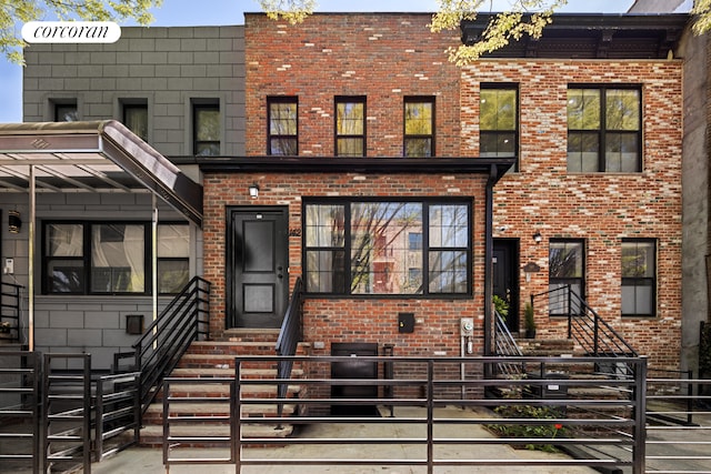 view of front of house featuring brick siding and entry steps