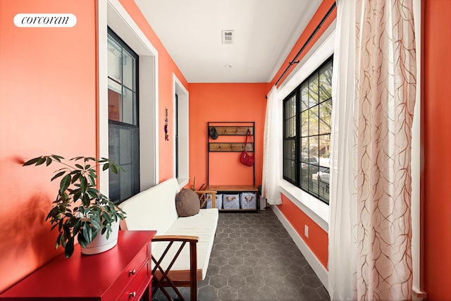 interior space with baseboards and visible vents