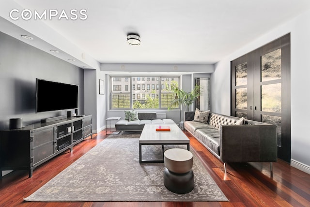 400 E 56th St Unit 3D, New York City, NY 10022 - living room with wood finished floors and baseboards
