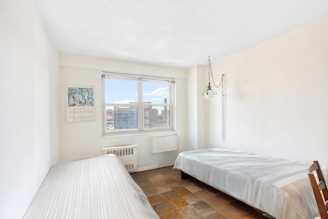 444 Neptune Ave Unit 6R, New York City, NY 11224 - bedroom with radiator heating unit and stone finish flooring
