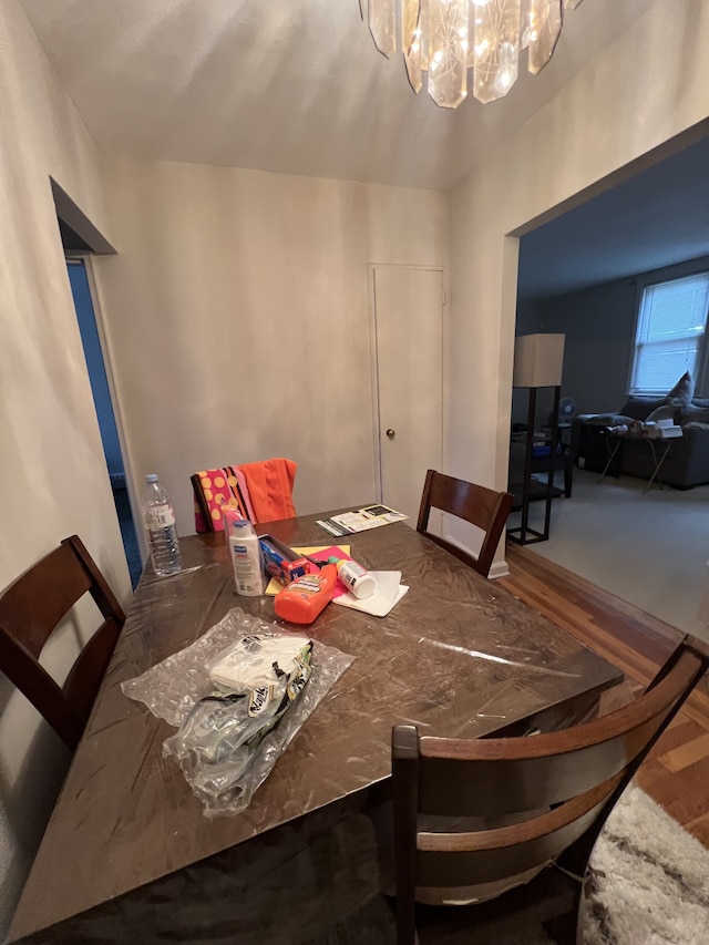 1774 E 54th St Unit 13B, New York City, NY 11234 - dining area featuring a chandelier and wood finished floors