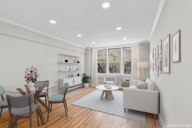 living room featuring crown molding, wood finished floors, recessed lighting, and baseboards