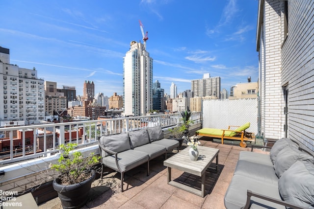 view of patio featuring a view of city and an outdoor hangout area
