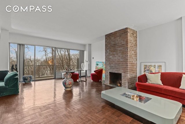 living room with a brick fireplace